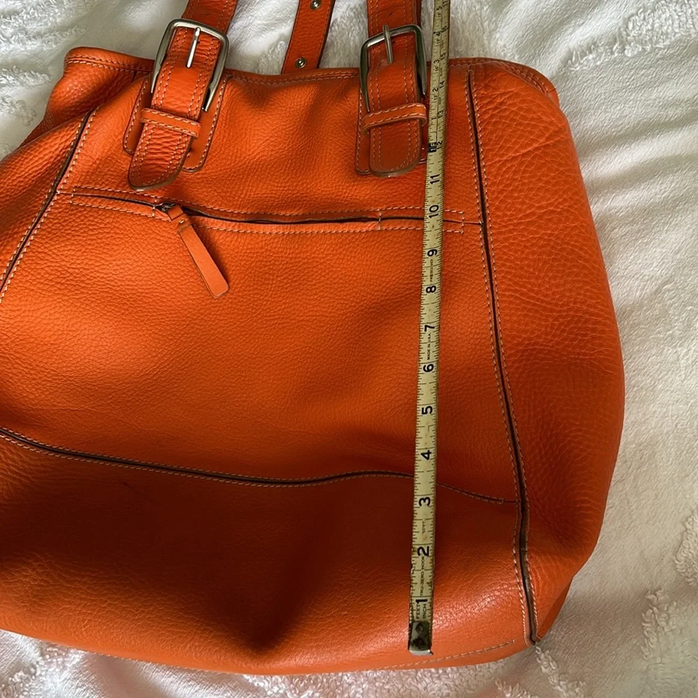 Large leather Cole Haan orange shoulder bag with silver hardware buckles. - Picture 8 of 16